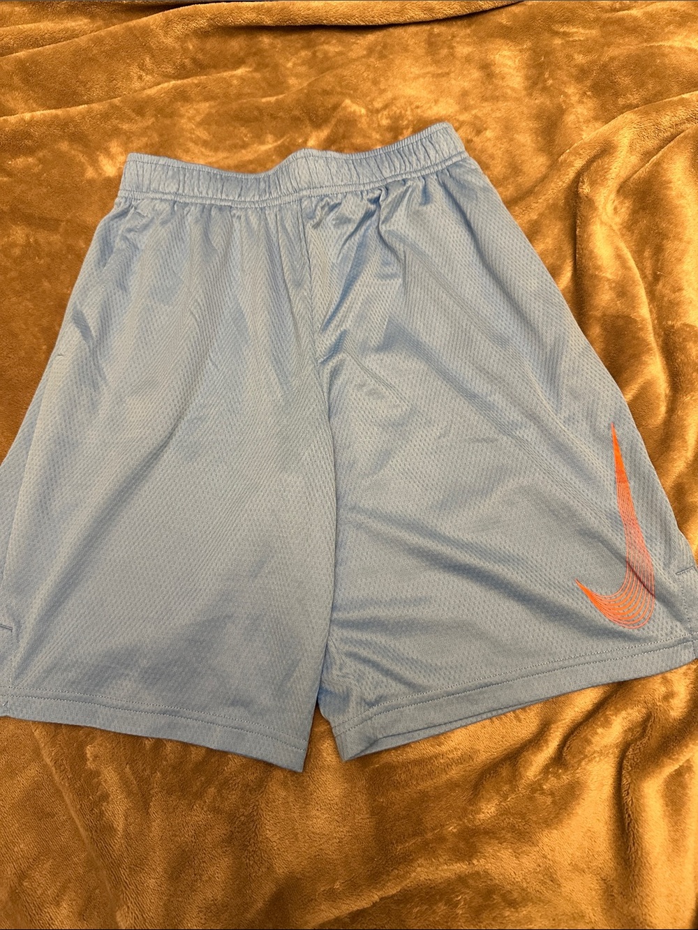 Nike Boy’s Light Blue Mesh Athletic Shorts with pink Swoosh